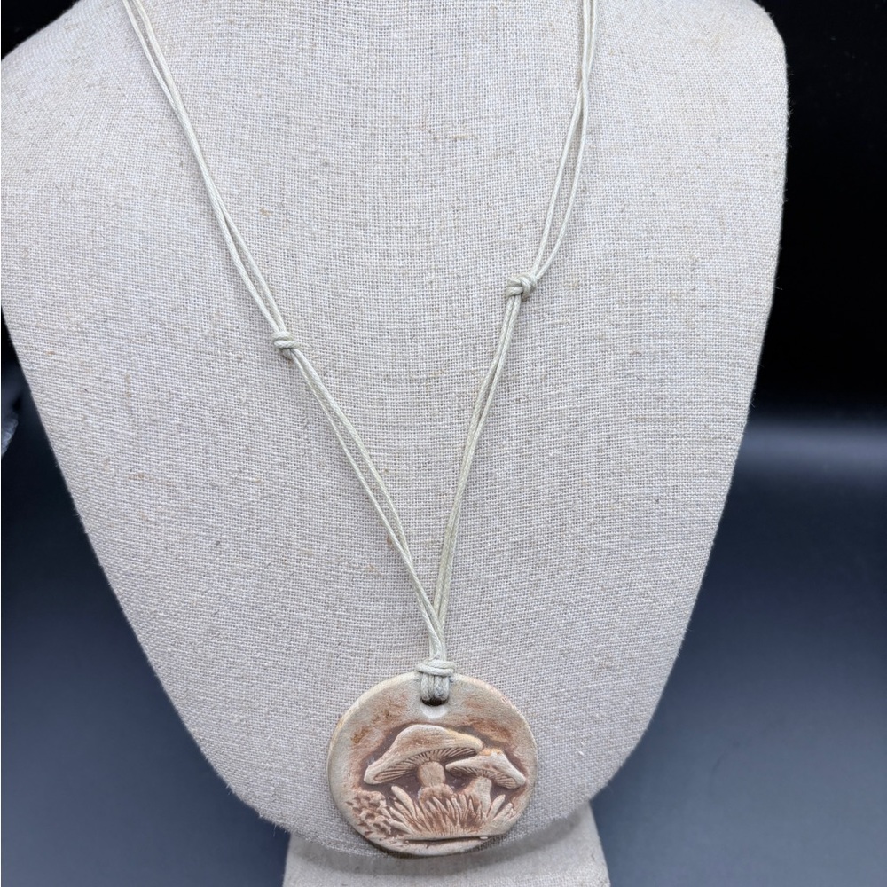 Cream Statement Necklace with Intricate Pendant Design